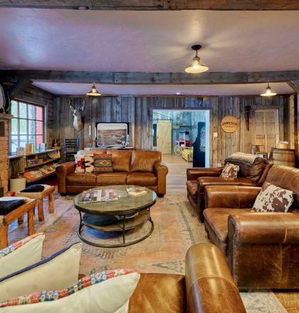 Cozy restaurant interior with warm lighting, wooden tables, neatly set chairs, and a calm dining vibe, perfect for a relaxing meal.