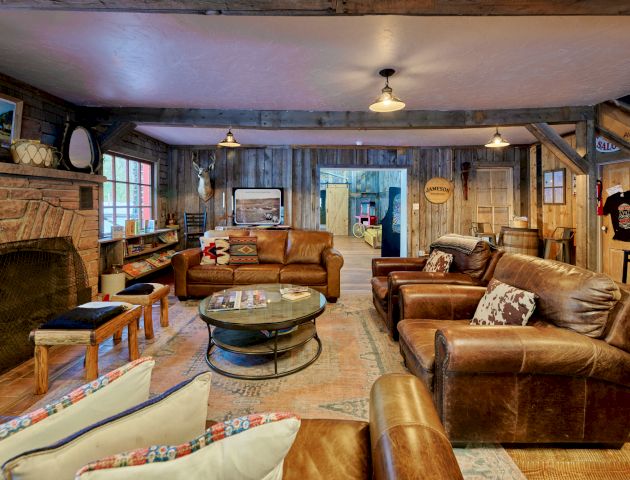 Cozy restaurant interior with warm lighting, wooden tables, neatly set chairs, and a calm dining vibe, perfect for a relaxing meal.