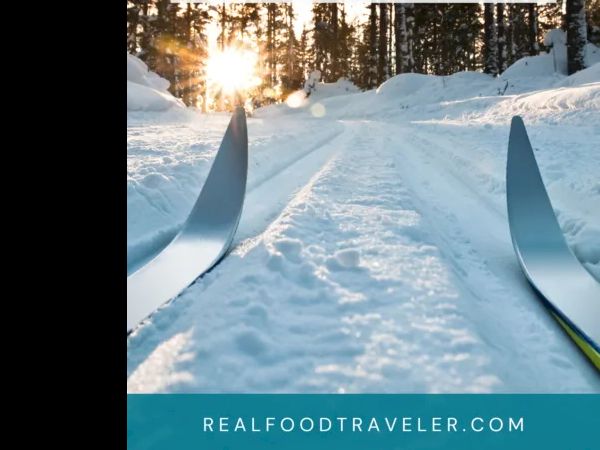 Cross-country skiing through a snowy forest at sunrise&mdash;gliding between trees with tips pointing toward adventure. realfoodtraveler.com